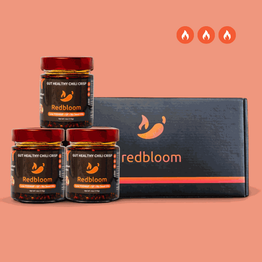 Advanced pack of gut-healthy best chili crisp jars with spicy heat level icons and branded box